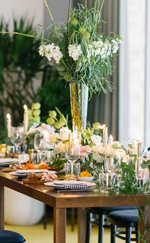 plates, utensils and glasses on top of a table