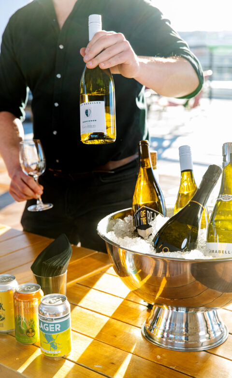 Private bartender serving wine