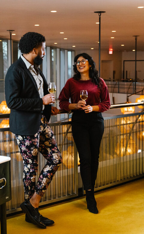 Guests mingling on the Mezzanine balcony
